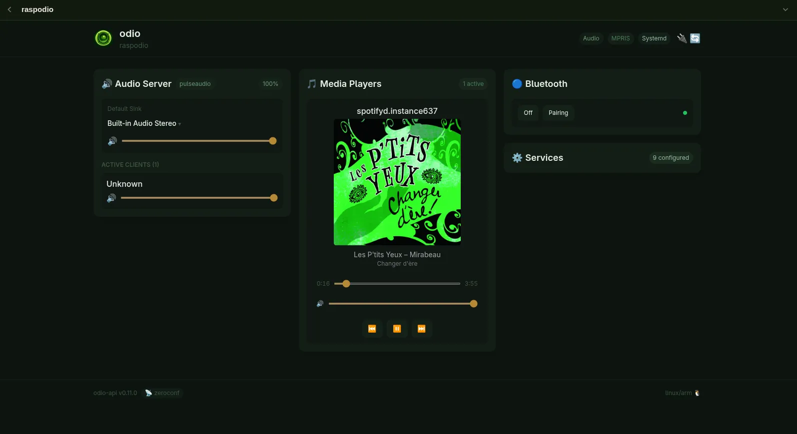 Embedded web UI showing the Audio Server with volume sliders, Media Players with Spotify playback and cover art, Bluetooth pairing controls, and Services management