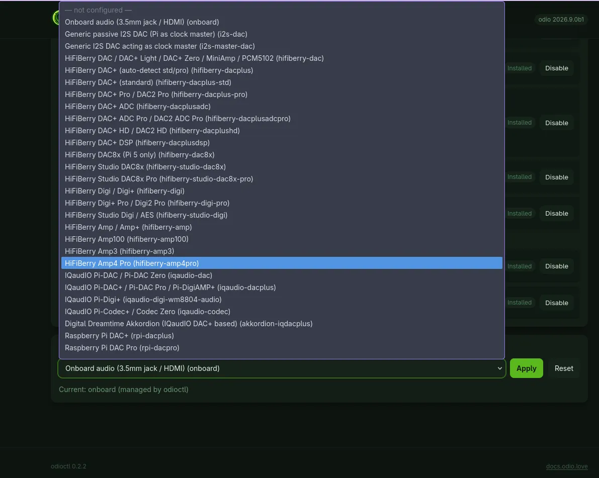 The DAC section of the settings page with the board list dropped down, showing a not configured placeholder, the onboard audio entry, two generic I2S entries and the HiFiBerry and IQaudIO ranges, each with its id in parentheses, above the Apply and Reset buttons and a line reading current: onboard, managed by odioctl