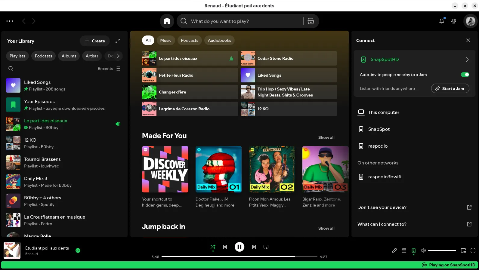 Spotify desktop app with the Connect panel open: SnapSpotHD is the selected target at the top, with SnapSpot, raspodio, and other devices listed below; the footer reads Playing on SnapSpotHD