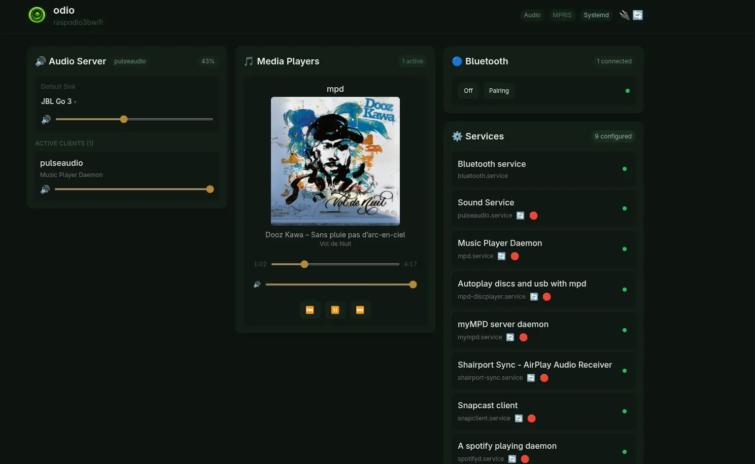 odio embedded UI playing a USB flash drive via MPD: Dooz Kawa - Sans pluie pas d'arc-en-ciel from Vol de Nuit, with album cover art and transport controls